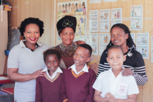 Alwaba with her teachers and friends