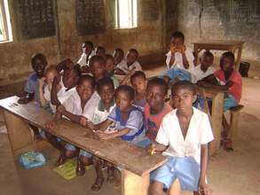 Students at the remaining dilapidated classroom