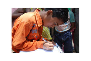 Feroz Khan, grade 3, demonstrates his writing
