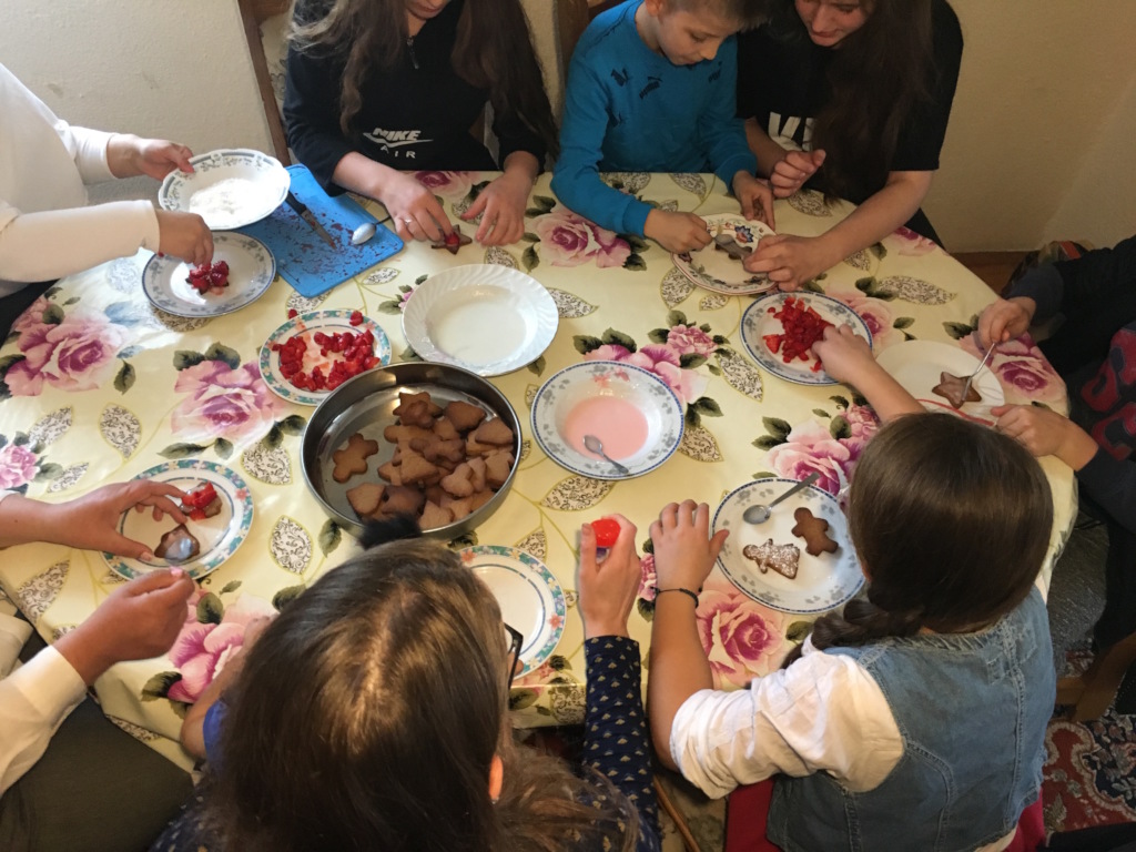 Decorating biscuits and laughing together