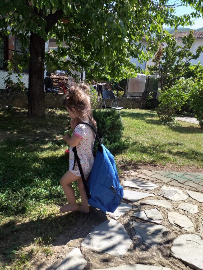 Lara practicing for nursery with a big backpack!