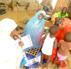 Home visit with excited beneficiary