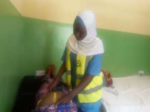 A volunteer doing antenatal screening