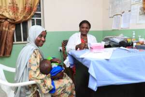 A health worker conducting postnatal counselling