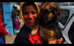 A HAPPY YOUNGSTER WITH HIS COMPANION AT OUR CLINIC