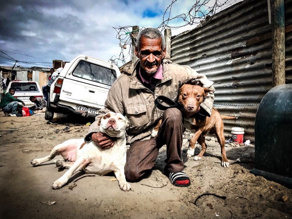 A Capricorn Resident proudly shows us his dogs