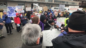 Families Speaking to Camera and Crowd