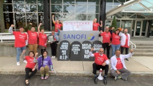 Activists at Sanofi delivering the gravestones