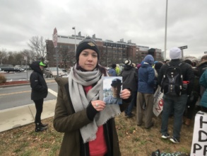 Activist Brittany holding photo of her brother