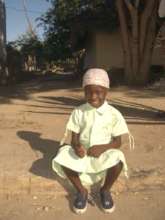 A child sitting in Mossuril