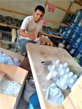 Ismael inspects each individual adapter