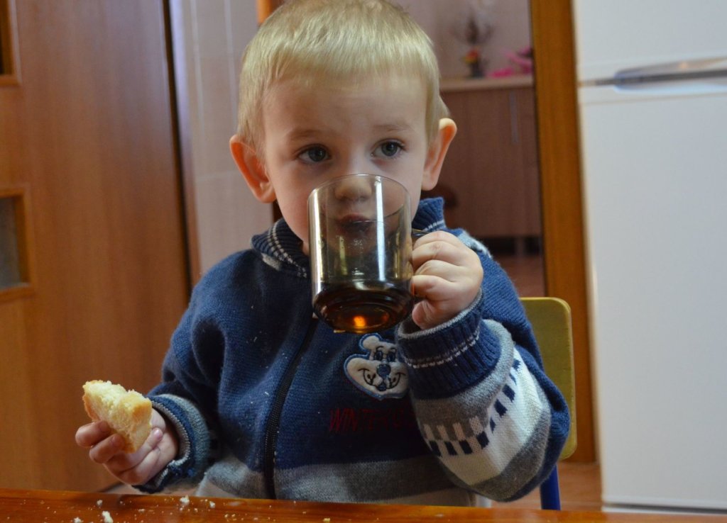 Share a table food with 25 Moldovan children.