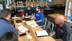 Trevor and a volunteer engaging with stakeholders