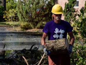 Volunteer doing debris removal and chainsaw work