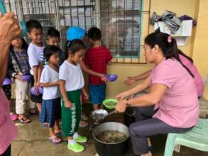 Mom's serve children school lunch