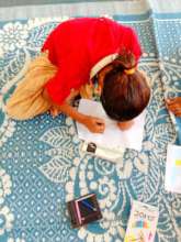 Child drawing during academic session at village