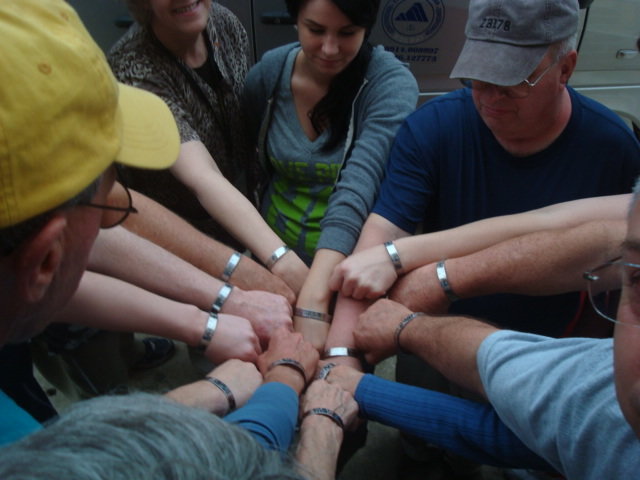 Team Members Wearing Olsen's MIA Bracelet