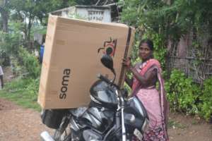 Veronica from VOICE Trust team hauling the gift