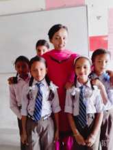 Teacher Bina with some of her students