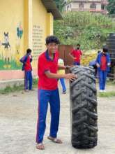 Helping with the tyres for the new playground