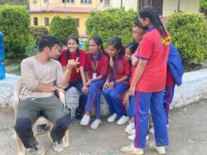 Volunteer Dai, with some of his students
