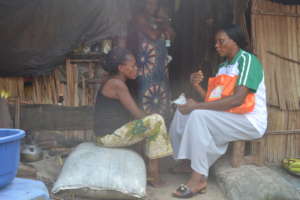 Community Health worker handing the kit