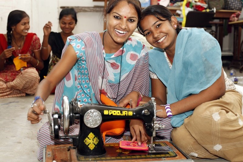 Offer a sewing machine to a Rajasthani woman