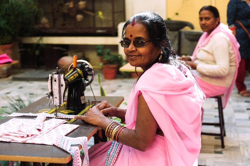 Offer a sewing machine to a Rajasthani woman
