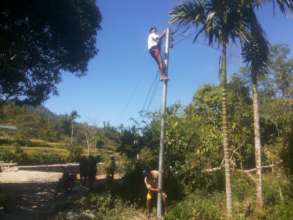 villagers reconnecting still usable electric wires