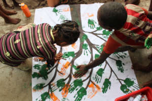 Children painting at SEED's after-school club