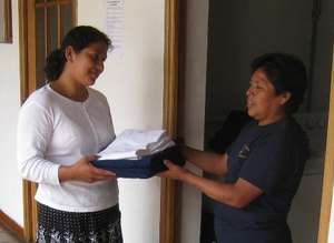 Welcoming a patient at Casa de Fe guesthouse