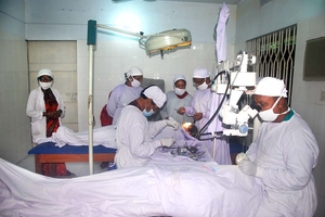 Doctors Performing Cat. Operation