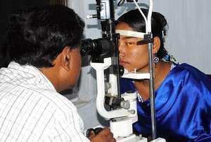 An Eye Specialist  Examining a Patient