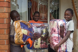 Donation: Kids receive blankets from Ryan and Abby