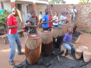 Playing "omugudo" Drums