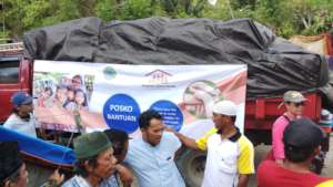 Arriving with trucks of supplies to distribute