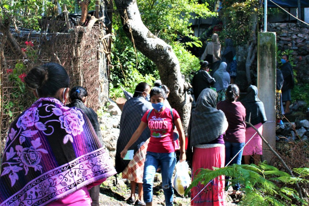 Women line up for food distribution 6-10 July