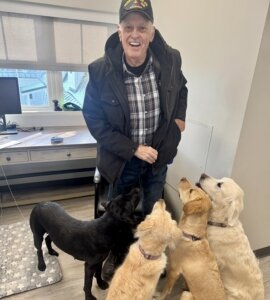 Army Veteran Dennis with WCC Pups