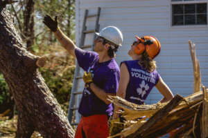 Volunteers doing chainsaw and debris work