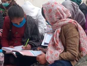 Students working in groups in learning center