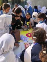 Fellow Syeda conducting a lesson on flowers