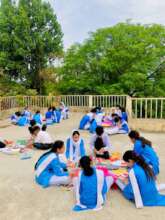 Sana's students celebrating Earth Day with posters