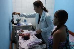 Pediatrician taking care of the  community members