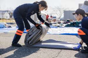 Staff set up tents in Suzu City