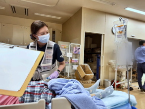 Peace Winds responder treats a patient