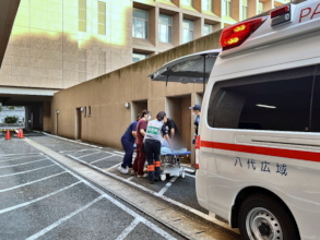 Peace Winds & hospital workers transport patient