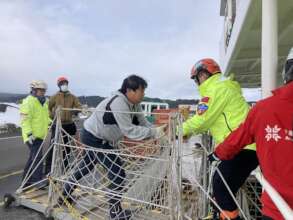 Unloading supplies from the Toyoshima Maru