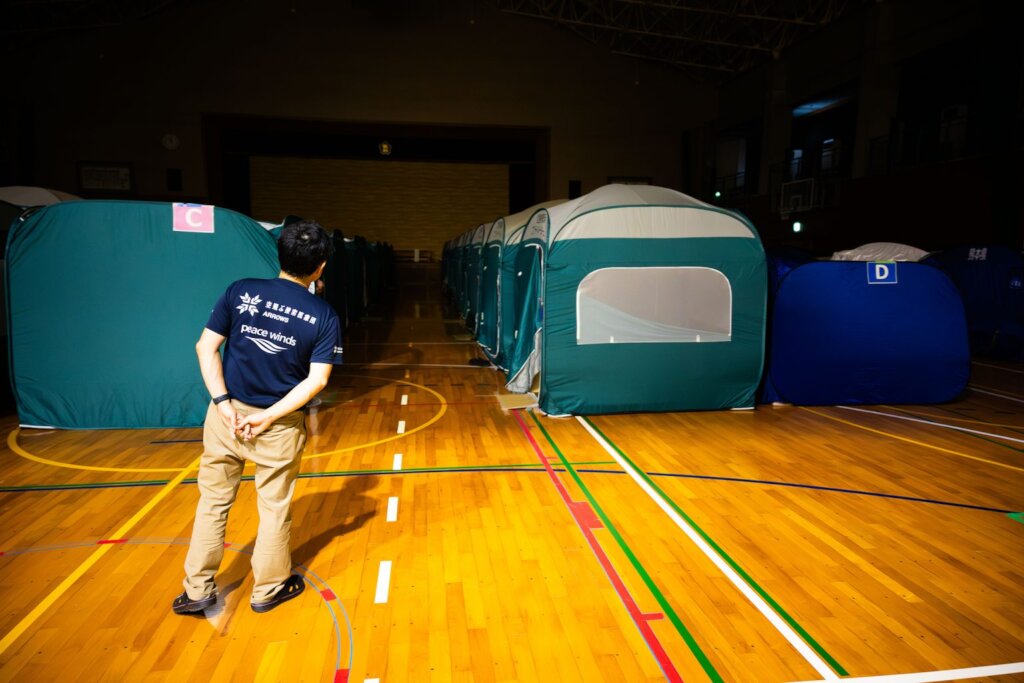Dr. Inaba checks tents where evacuees are sleeping