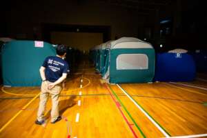Dr. Inaba checks tents where evacuees are sleeping