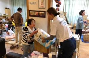 Staff hand out supplies to community members